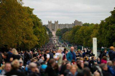 Thousands gather for the funeral procession of Queen Elizabeth as Britain says goodbye
