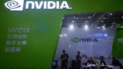 Stocks making the biggest moves midday: Nvidia, Tesla, Coinbase and more